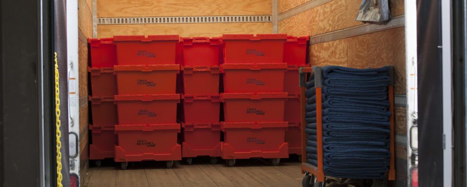 Stacks of Office Move Pro E-Crate Moving Box Rental