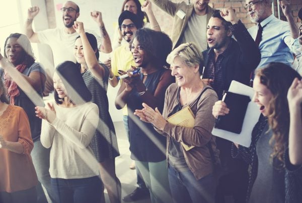 office colleagues cheering and clapping